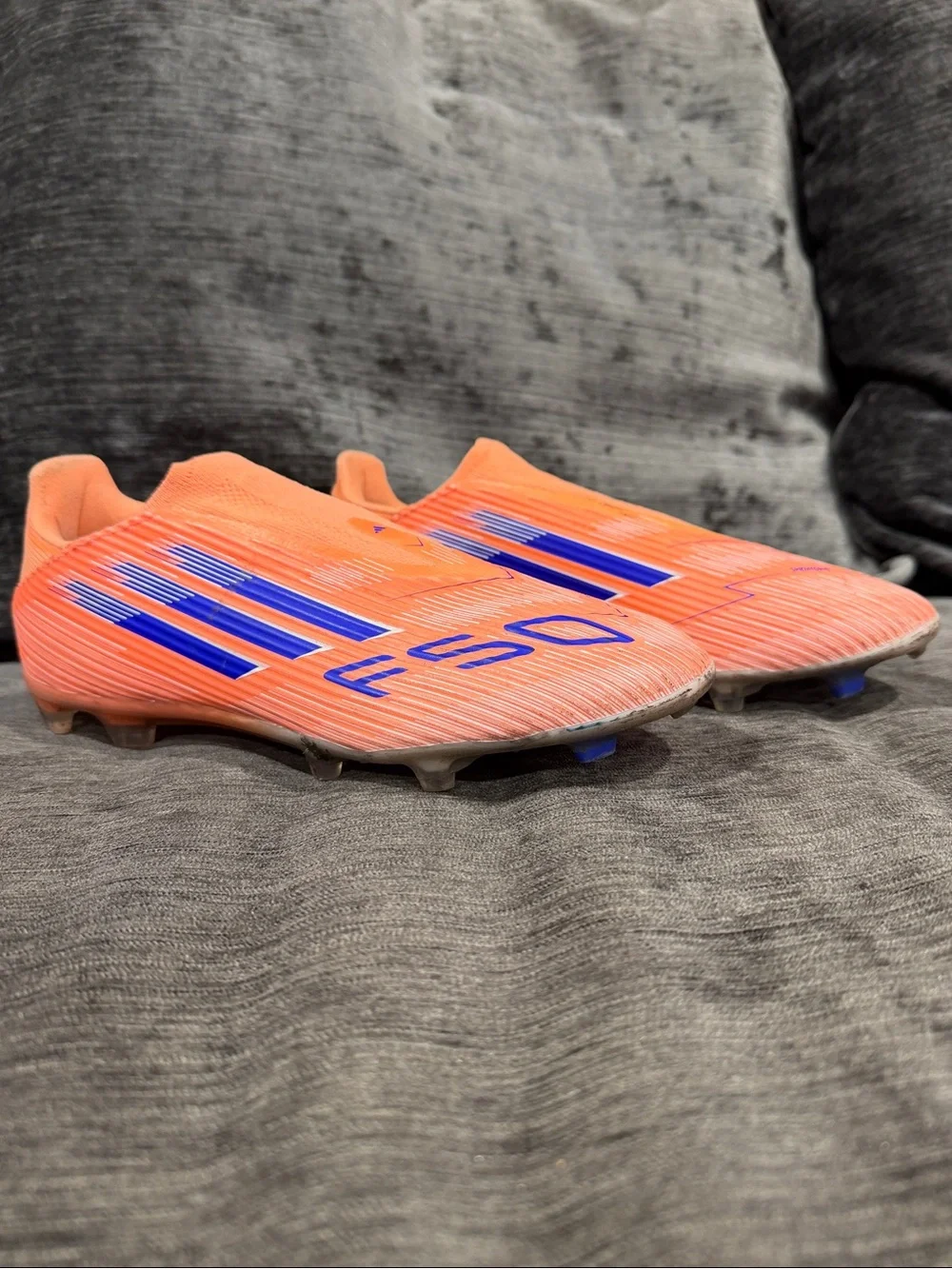 adidas Laceless Soccer Cleats in Neon Orange with Blue Accents